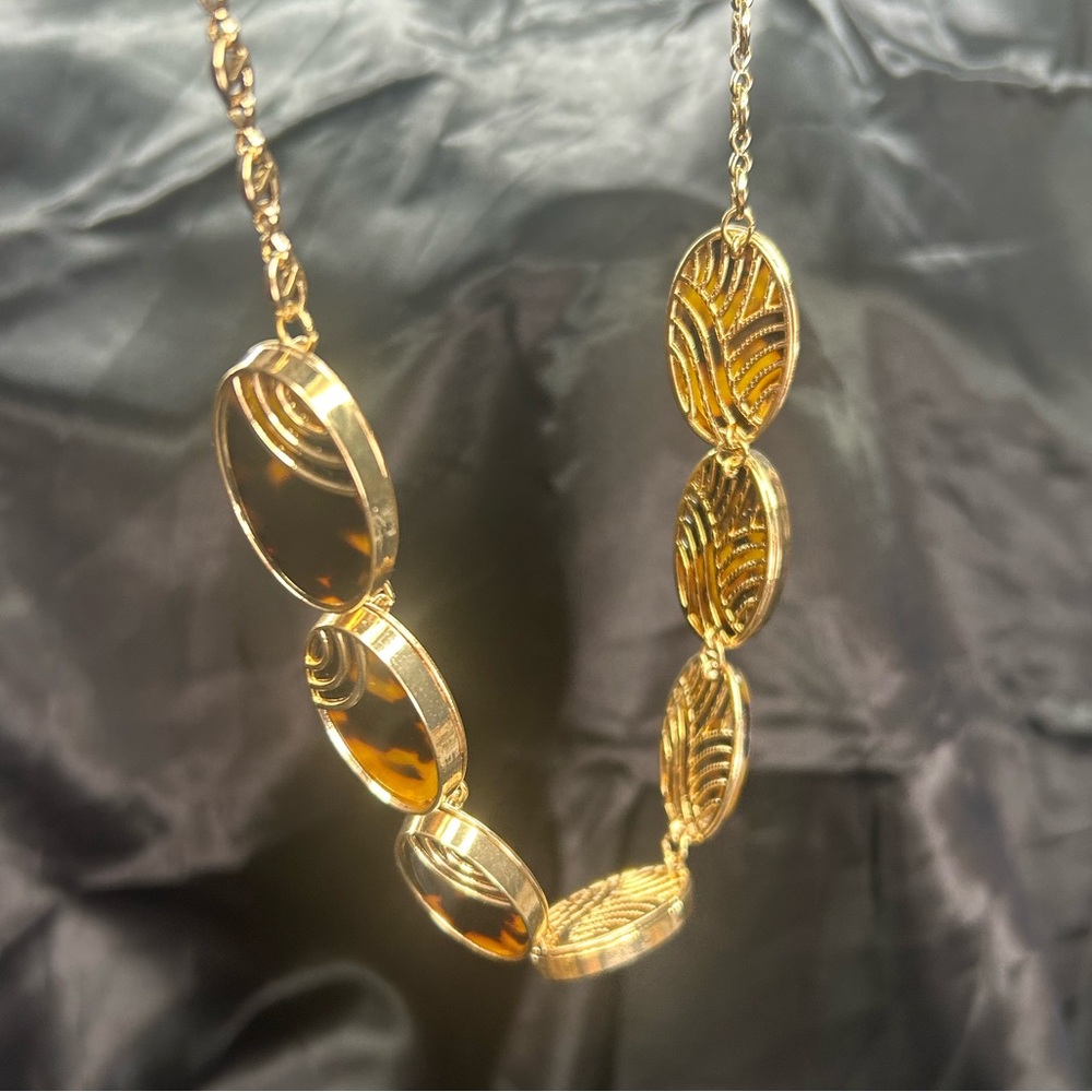 Women’s gold tone necklace with leopard print stones